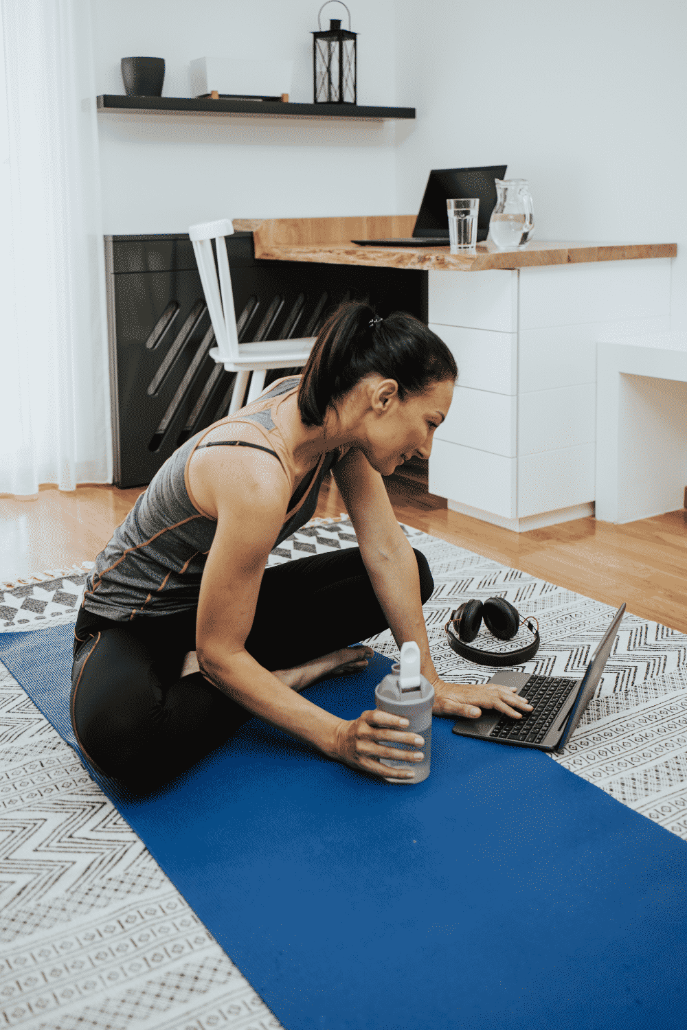 A woman takes a break from remote work to exercise