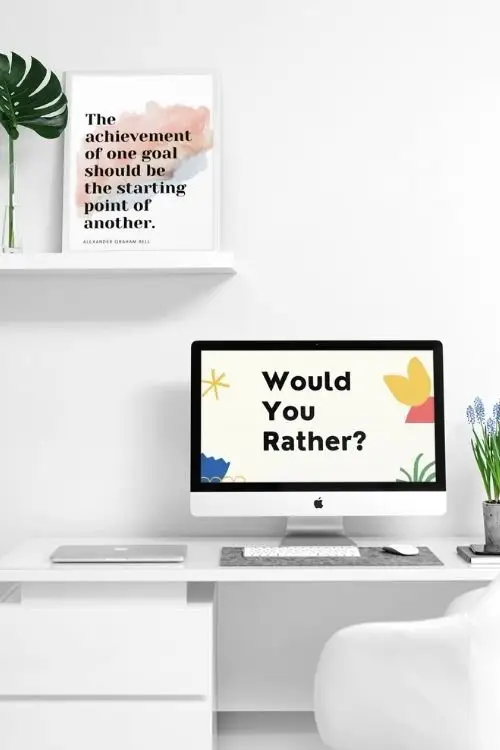 Would You Rather Virtual Game is shown on a computer  sitting on a clean, white desk