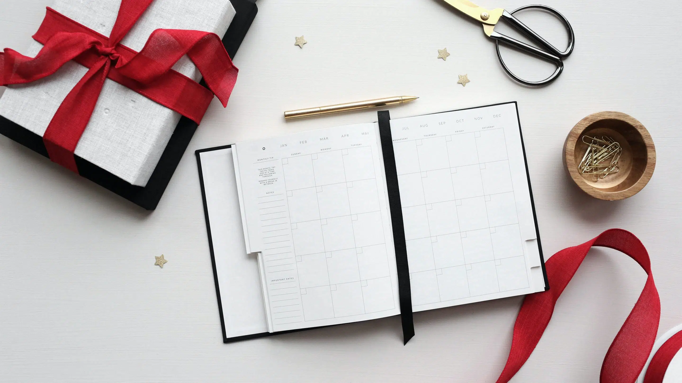 Gift sitting on a desk with a planner